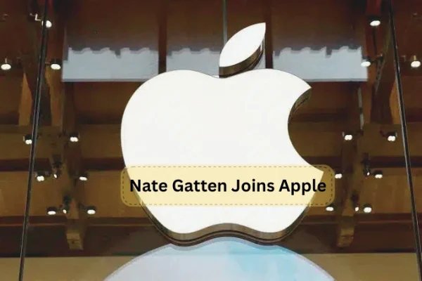 Nate Gatten joins Apple, smiling and holding an Apple product, surrounded by colleagues in a modern office setting.